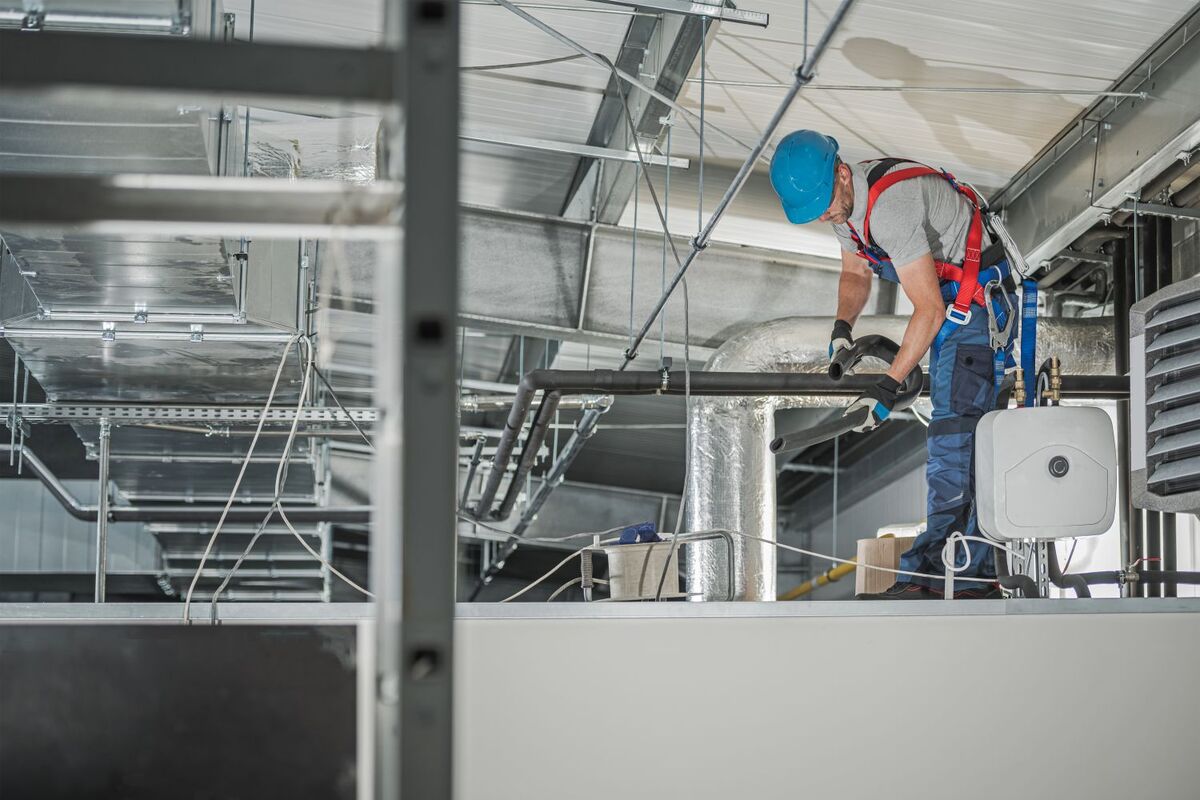 HVAC tech finishing a new system