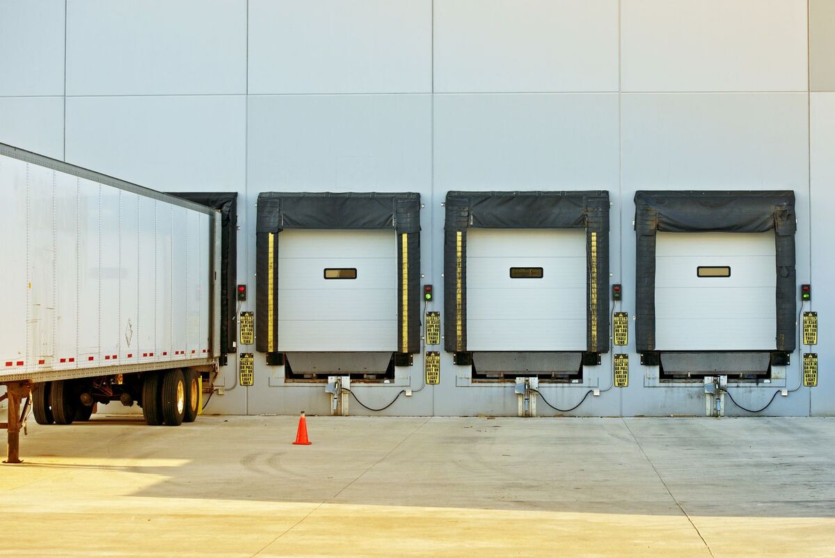 semi truck at loading dock with 4 dock doors