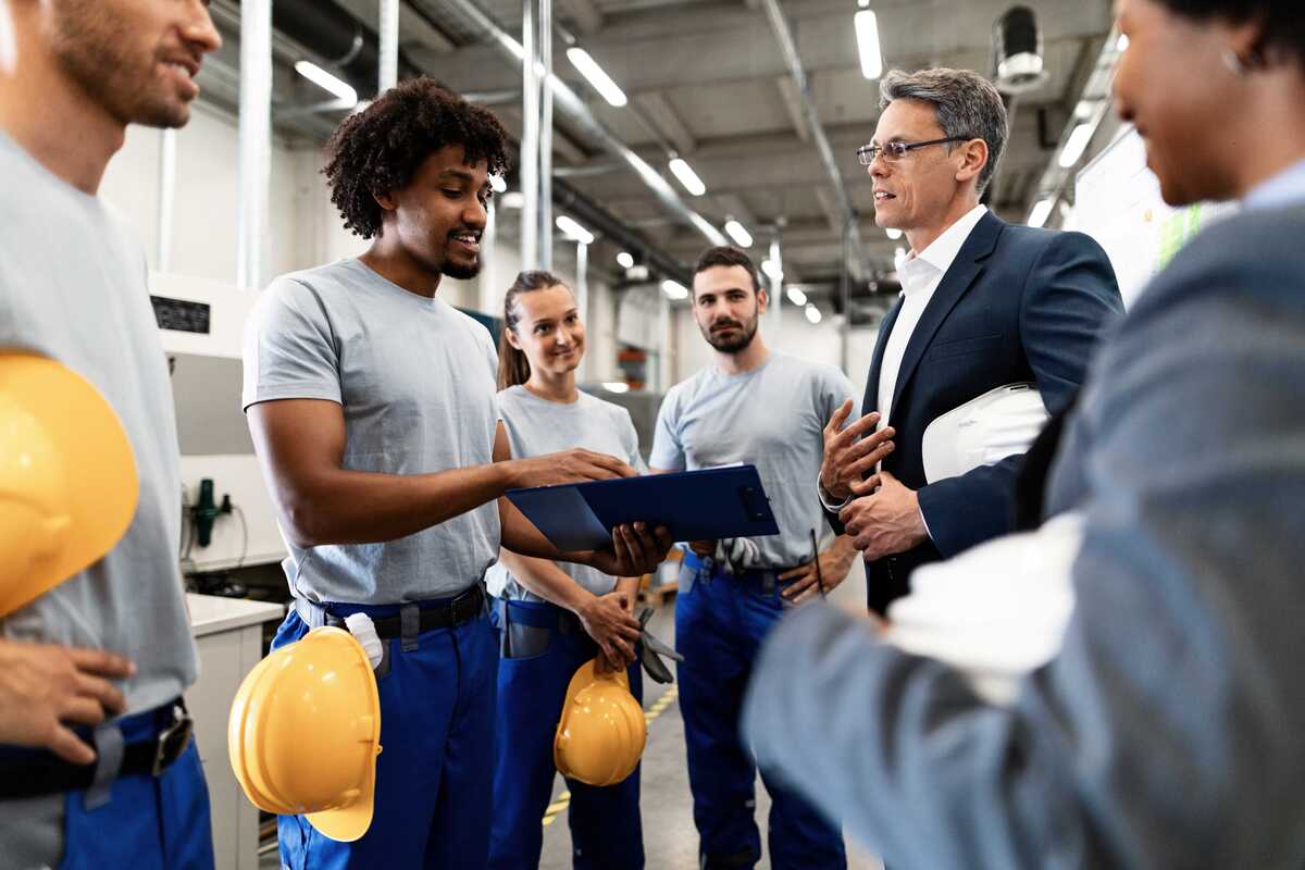 workers talking with company manager